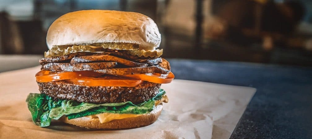 Impossible burger with vegan cheese and mushrooms